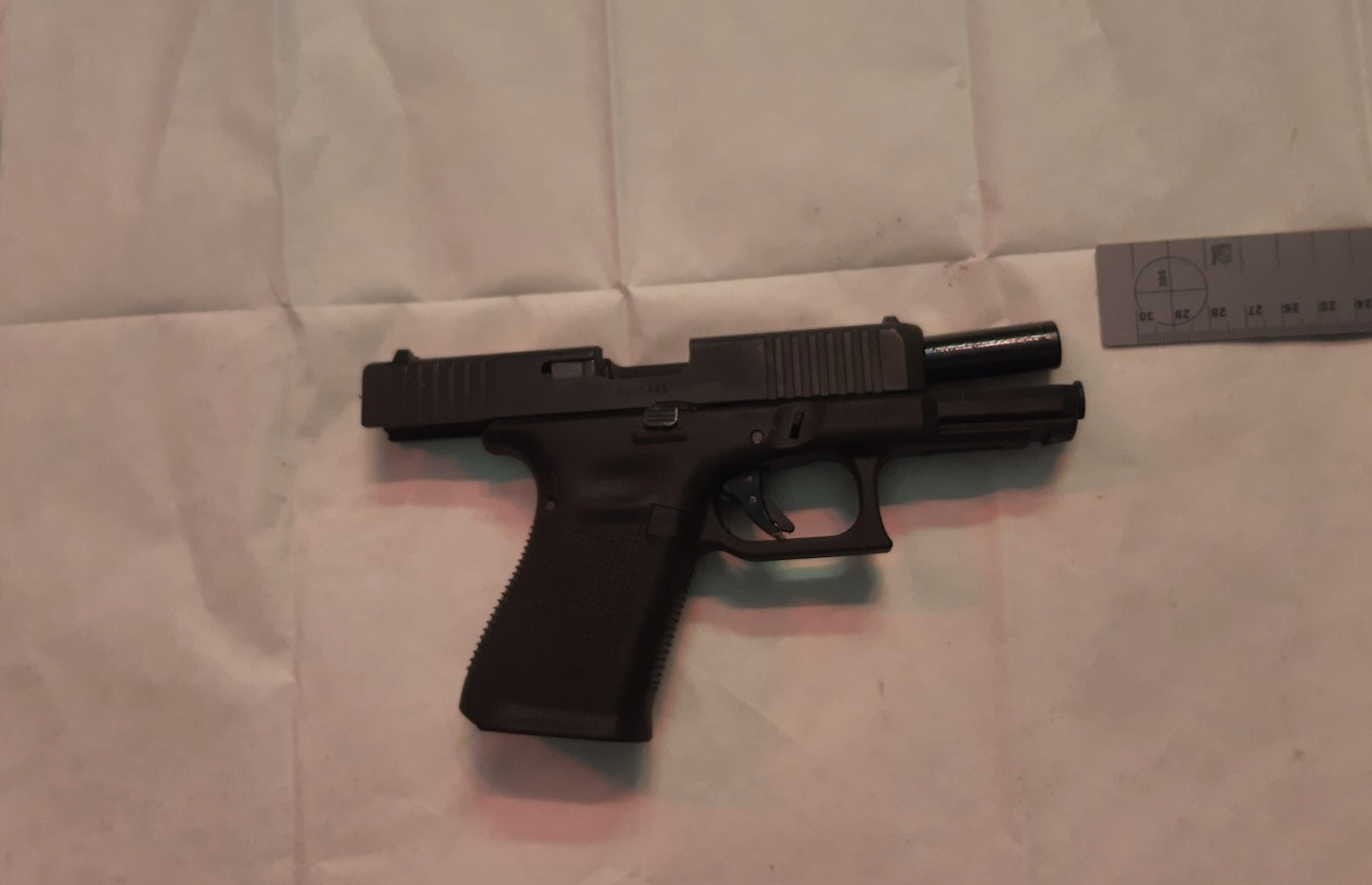 Man charged after seizure of 55 loaded handguns with hundreds of rounds of ammunition