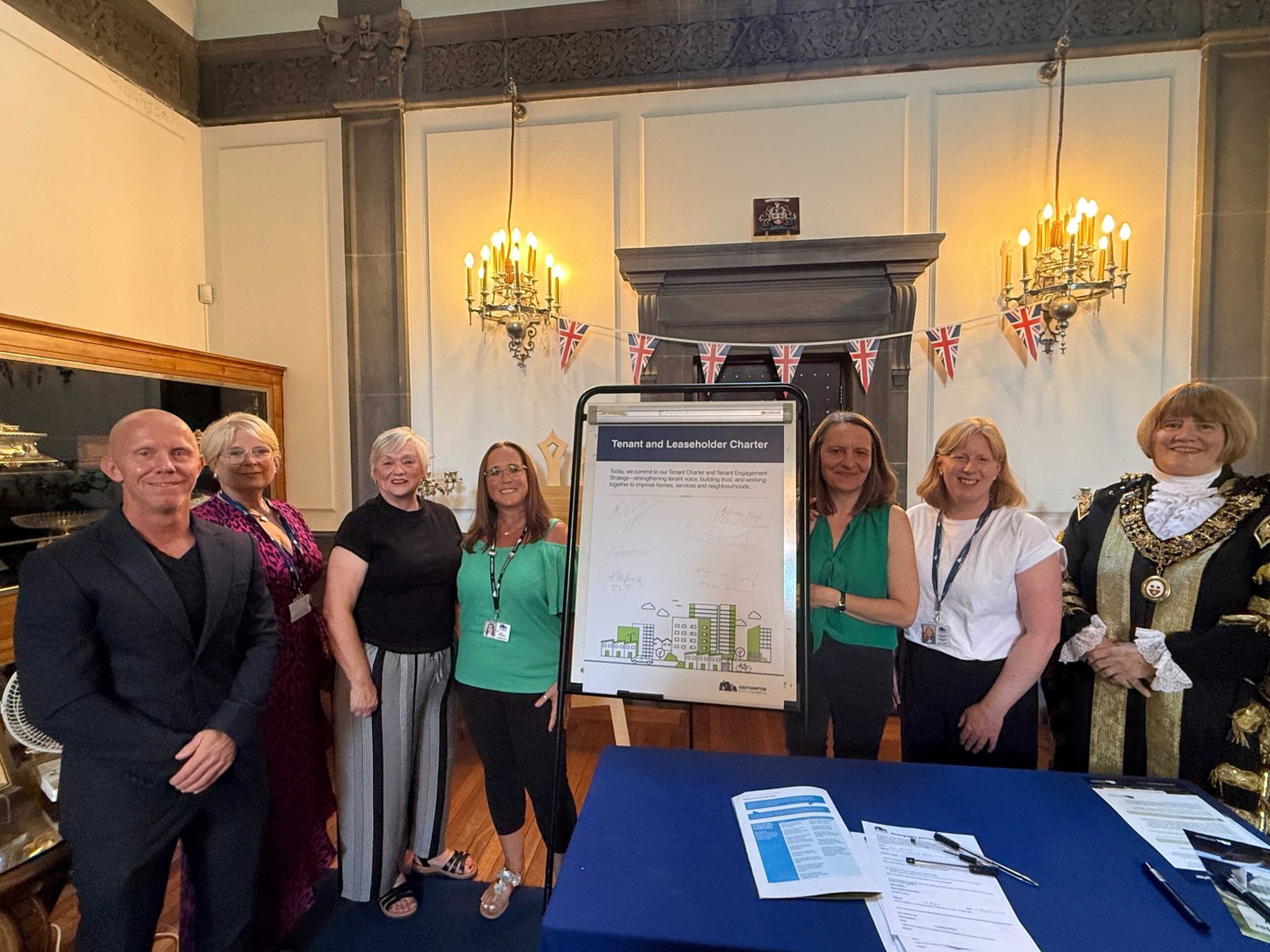 Tenants join council staff to sign the new Tenant Charter